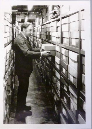 Photo of Arthur Rigby in a document strongroom at Gloucestershire Record Office, mid-1980s