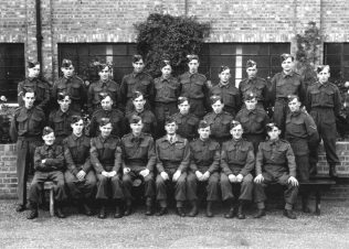RT018 No. 42 Platoon - Home Guard. Oct 1944.  Ralph is standing behind the officer (front centre).  | The Ralph Tucker Collection