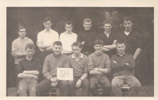 In this picture taken on the outward bound course, Martin can be seen on the back row, on the far left