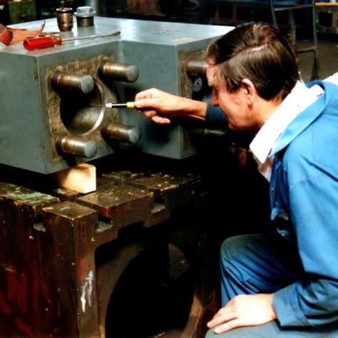 No.24  John Mabbett inspecting an accumulator outlet stop valve block
