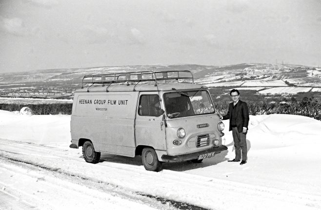 The Heenan Group Film Unit's first transport, a Morris Van. Taken in the winter of 1964/1965 on the Heads of the Valley road in Wales, following a film shoot of 1128 ton Shear at Birds (Swansea) Ltd., Scrap Metals, Bynea, Nr. Llanelli. Brian Mince (standing), driver Ron Gordon from Worcester Unit. Pete Skelton behind the camera | Kindly supplied by Pete Skelton, Sept. 2016