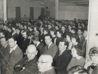 The audience of F&P staff enjoying a Workers' Playtime concert