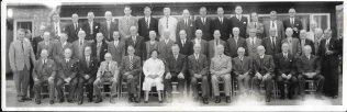 Grandfather William Dix (centre row behind 4th from left seated person).  Occasion and date unknown, possibly a long service awards ceremony? | from the Bonita Gadd collection